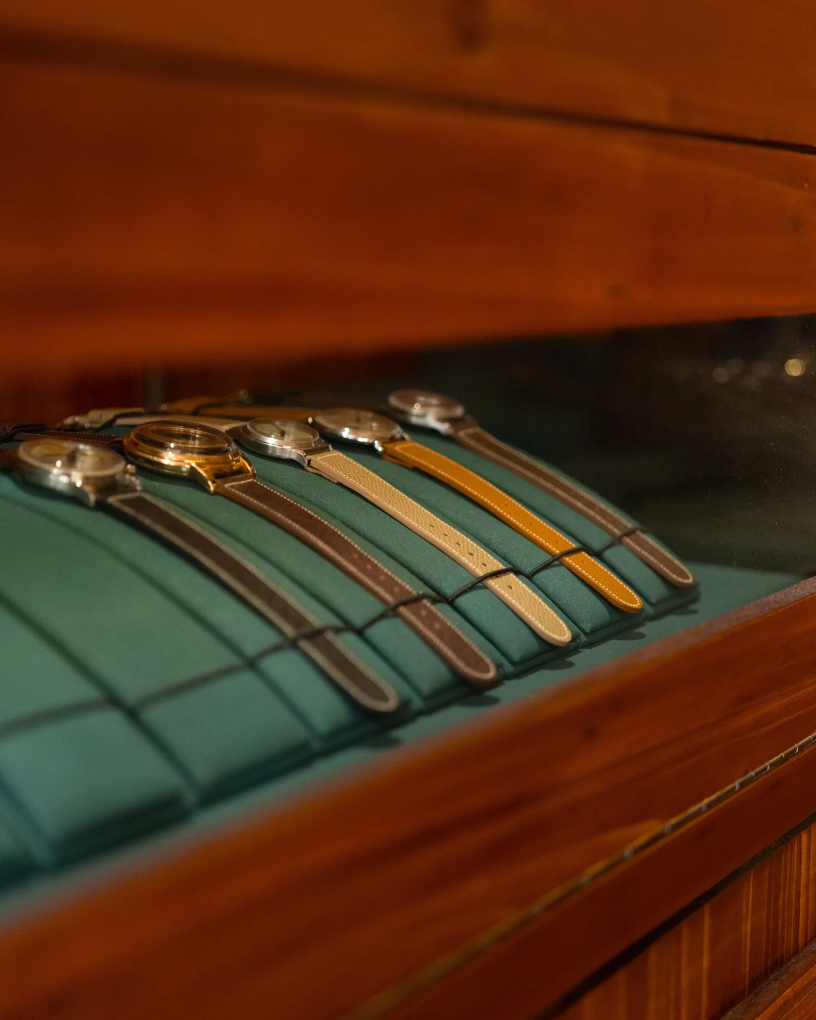 Watches and straps in a glass display